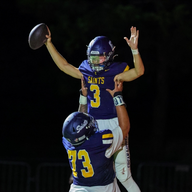 Senior lineman erik cruz lifts caden jones in celebration of a crean lutheran touchdown 640x640 c
